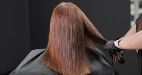 Professional hair straightening process focusing on smooth and shiny results after mask treatment keratin in salon care.