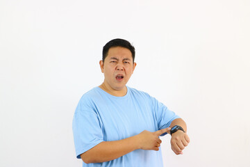 Man pointing at watch showing urgency or impatience