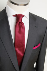 Elegant Business Attire: Charcoal Suit with Burgundy Tie and Pocket Square