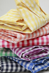 Stack of colorful gingham shirts