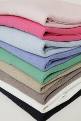 Stack of colorful folded sweaters