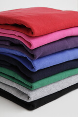 Stack of colorful folded sweaters