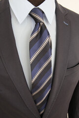 Man in a suit with a striped tie