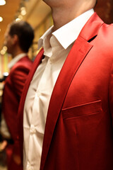 Man in a red suit and white shirt