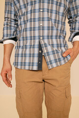 Man in Plaid Shirt and Cargo Pants
