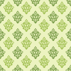 Ornate vintage floral design in shades of green on a pale background, repeating symmetrically.