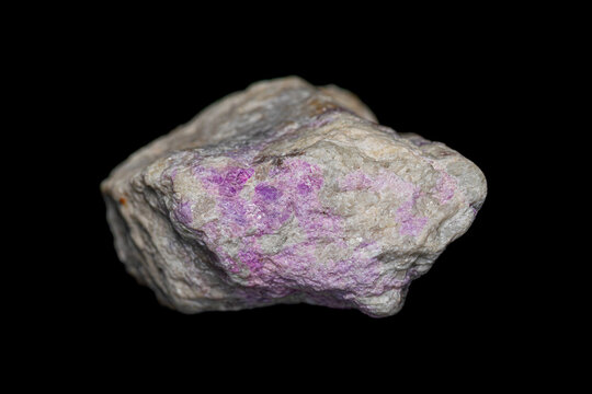 Hackmanite gemstone on richterite matrix, a rare variety of the mineral sodalite (tectosilicate mineral) can change color in sunlight (UV) (selective focus)