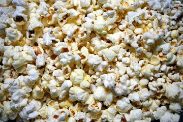 close-up image of a pile of freshly popped, hot, salty popcorn