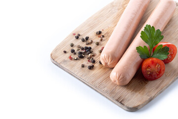 Raw Frankfurt sausages with cherry tomatoes and parsley isolated on white background. Copy space