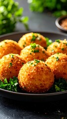 Golden fried appetizer balls with fresh herb garnish