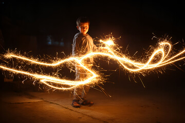Boy holding lit sparkler festive night celebration