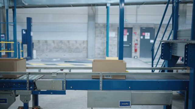 Boxes moving along a conveyor belt in factory in France.