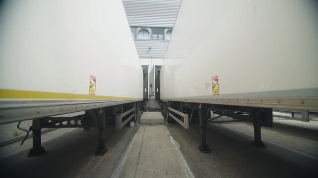 Line of metal containers for shipment in a warehouse in France.