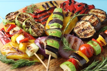 Vegetarian barbecue. Tasty grilled vegetables and rosemary on table, closeup