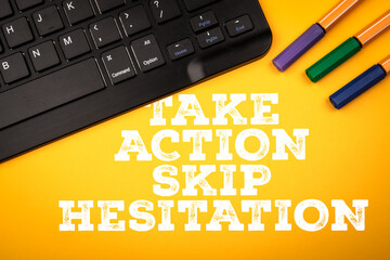 Take Action Skip Hesitation. Bright yellow background with colorful markers and a keyboard