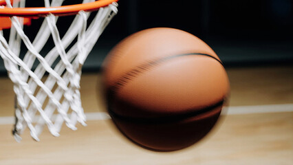 Basketball game moment, close-up of ball flying mid-air towards hoop, dynamic sports photography, motion blur, cinematic lighting
