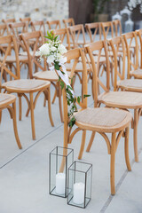 Outdoor wedding ceremony seating with floral decor

