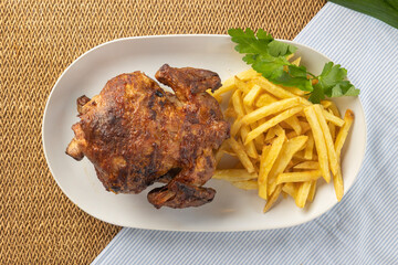 Grilled whole chicken with crispy french fries meal