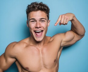 A joyful, muscular man displays a confident and expressive pose against a vibrant light blue backdrop.