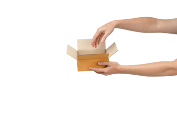 This is a photograph of an open, empty light-brown cardboard box being held by two hands  against a clean, isolated white background. The image clearly communicates delivery, receiving, giving, or unb