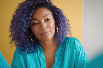 Fototapeta premium A young woman with curly purple hair wearing a teal blouse, looking thoughtfully in a bright, colorful environment. Ideal for beauty and fashion themes.