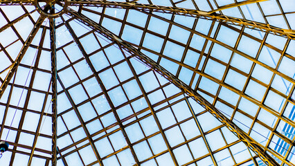 Glass metal frame ceiling with blue sky view