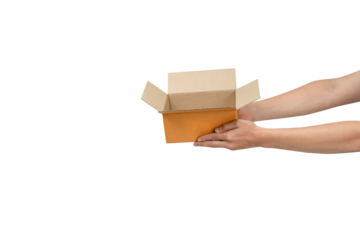 This is a photograph of an open, empty light-brown cardboard box being held by two hands  against a clean, isolated white background. The image clearly communicates delivery, receiving, giving, or unb