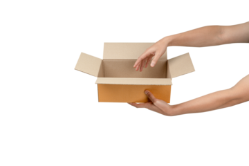 This is a photograph of an open, empty light-brown cardboard box being held by two hands  against a clean, isolated white background. The image clearly communicates delivery, receiving, giving, or unb