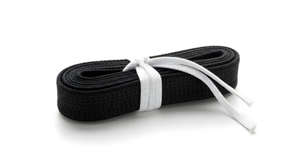 Rolled black martial arts belt tied with white rope, representing achievement, skill, and dedication in training