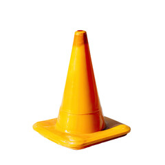 Bright yellow traffic cone against black background