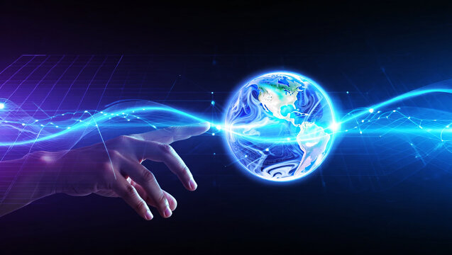 Human hand touching glowing earth with blue energy streams globe