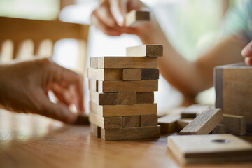Closeup hand holding wooden block game