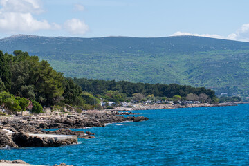 KRK Island, Croatia - April 19, 2025: Cityscape. View of the coast and the city's rocky beaches
