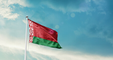Belarus national flag fluttering. The flag blowing in beautiful soft sky. Belarus national flag for independence day.