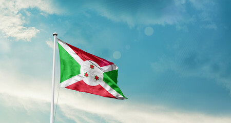 Burundi national flag fluttering. The flag blowing in beautiful soft sky. Burundi national flag for independence day.