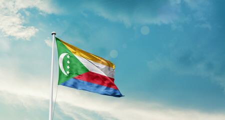 Comoros national flag fluttering. The flag blowing in beautiful soft sky. Comoros national flag for independence day.