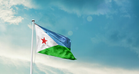 Djibouti national flag fluttering. The flag blowing in beautiful soft sky. Djibouti national flag for independence day.