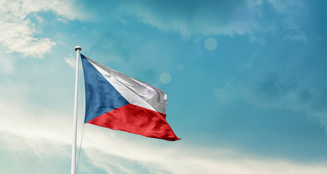 Czech Republic national flag fluttering. The flag blowing in beautiful soft sky. Czech national flag for independence day. - Powered by Adobe