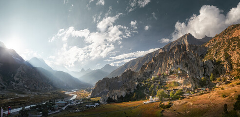 Panoramic view of ancient village of Bhraka and valley with Marsyangdi River flowing along northern slopes of Annapurna Himalayas, Nepal.