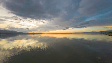 Sunset Reflection on a Calm Lake Water