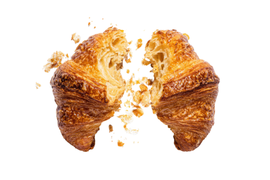 Two halves of a golden croissant, broken open, reveal a light interior.  Crumbs scattered