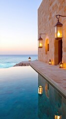 A tranquil seaside setting features a stone wall, glowing lanterns, and a serene pool reflecting the ocean at dusk, Ideal for promoting luxury travel, relaxation, or seaside retreats,