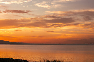 Calm Lake at Sunset with Orange Sky