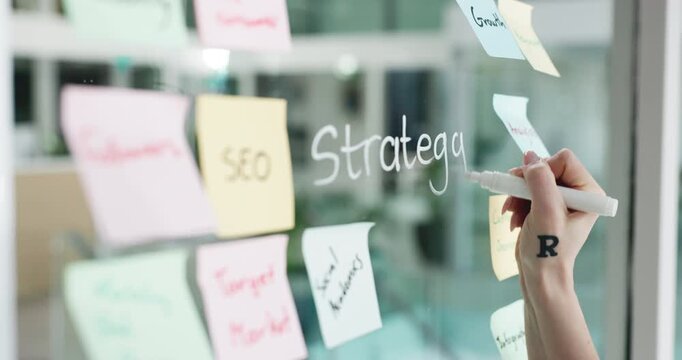 Business woman, hands and writing on glass wall for campaign development, brand strategy or SEO. Marketing manager, sticky notes or planning in office for project management, market research or ideas