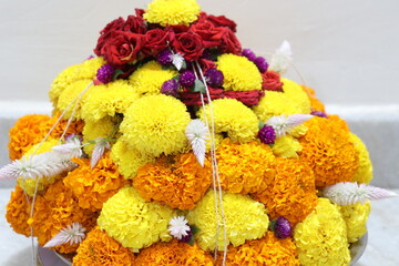colorful flowers stacked up to create bathukamma, a specific hindu god worshiped in south india