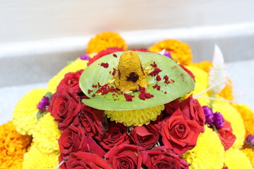colorful flowers stacked up to create bathukamma, a specific hindu god worshiped in south india