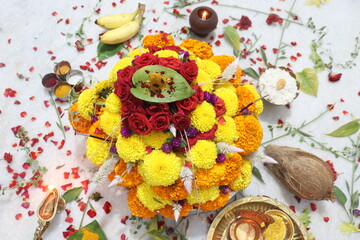 colorful flowers stacked up to create bathukamma, a specific hindu god worshiped in south india