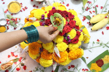 colorful flowers stacked up to create bathukamma, a specific hindu god worshiped in south india