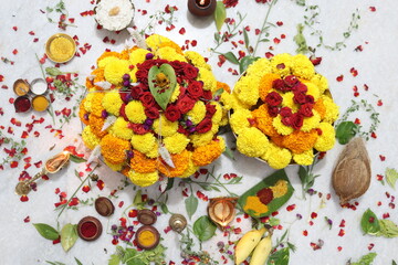 colorful flowers stacked up to create bathukamma, a specific hindu god worshiped in south india