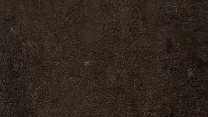 Dark, textured leather backgrounds in black and brown material make a rough pattern surface design.